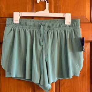 Women’s Mid Rise shorts with built in briefs Size medium Brand New